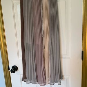 Long pleated muted colored skirt